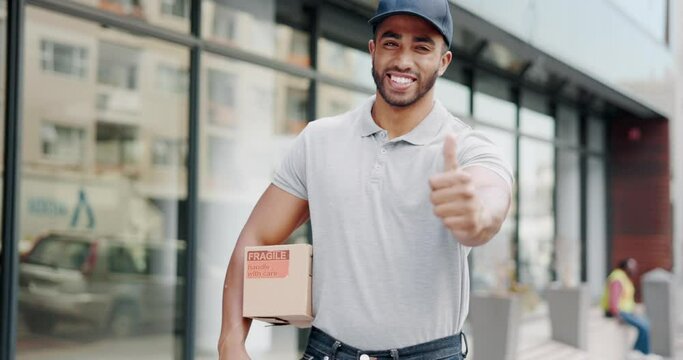 Delivery man, smile and thumbs up for success, ecommerce, shipping or package in city. Portrait of happy male in logistics showing thumb emoji for yes sign, like or approval with parcel box in town