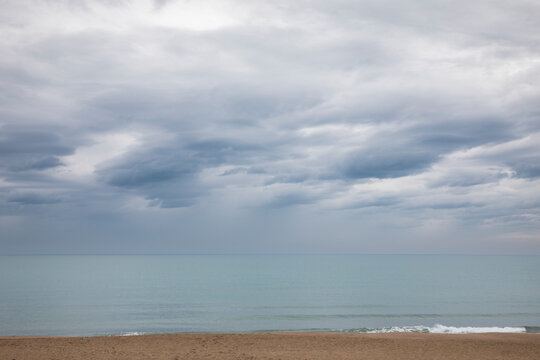 Italian maritime landscape on a gray spring day. Very cloudy sky