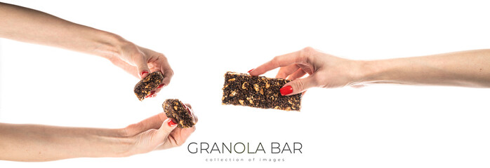 Healthy granola bar (muesli or cereal bar) isolated on white background. Muesli bar in females...
