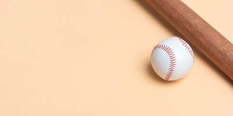 Baseball bat and ball on beige background. Horizontal sport theme poster, greeting cards, headers,...