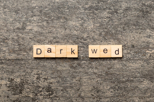 Dark web word written on wood block. Dark web text on cement table for your desing, concept