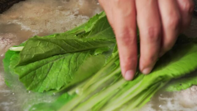 The cooking process of characteristic Chinese food pak choi meatball soup