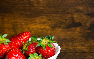 Fresh strawberries on a wooden background