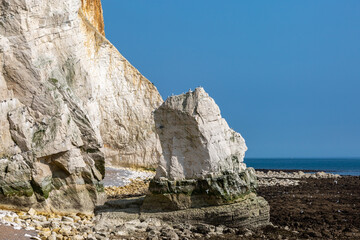 A view of the chalk cliffs and stack rock at Seaford, on a sunny spring day