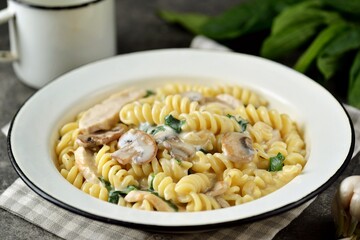 Рasta with mushrooms, chicken and spinach in a creamy sauce