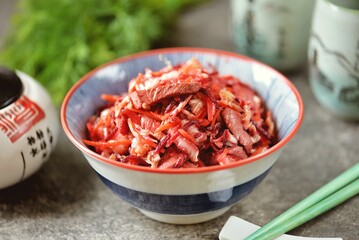 Chinese salad with meat, Chinese cabbage, beets, onions, carrots, olive oil and vinegar
