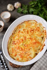Potato gratin with cream, nutmeg cheese and garlic