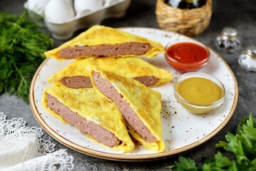 Beef schnitzel in an omelet.