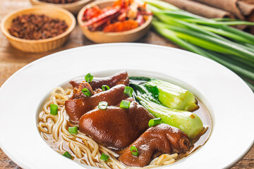 A bowl of pork knuckle noodles