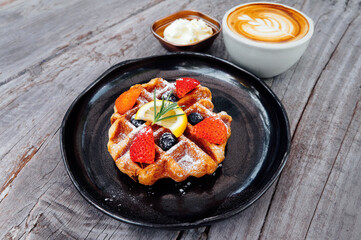 Fresh homemade strawberry waffle with berries