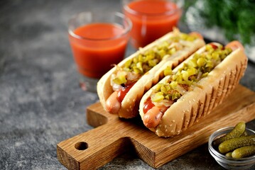 Homemade hot dogs with fried onions and pickled cucumbers.