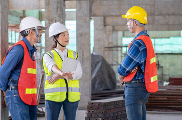 team of civil technician engineers discuss the timeline with architect foreman worker while inspecting, check safety infrastructure construction progress for sustainable green building at project site