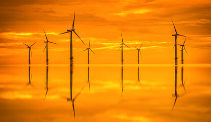 Sunset Offshore Wind Turbine in a Wind farm under construction off the England coast