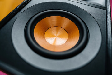 A close-up of a modern, high-end sound system consisting of black loudspeakers and expensive audio equipment for a professional studio or club or living room - cooper woofer