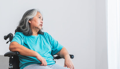 Asian elderly woman patient sat on wheelchair, which she is saddened from depression. to elderly and health care Our Minds Matter concept. - obrazy, fototapety, plakaty