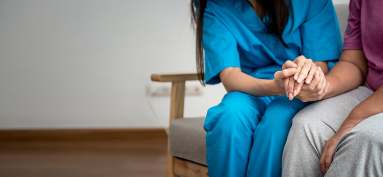 Woman doctor holding hand,  take care and encourage elderly patien, which she is saddened from depression, to elderly and  health care concept.