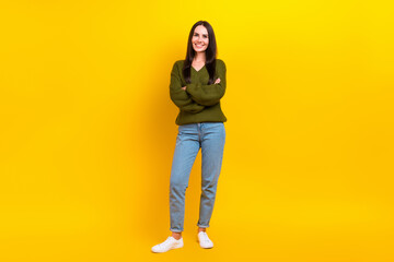 Fototapeta premium Full length photo of adorable pretty woman dressed khaki sweater arms crossed isolated yellow color background