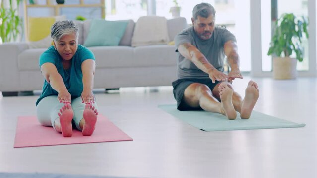 Yoga, meditation and senior couple stretching, exercise and pilates training for wellness, bonding or stress relief. Fitness, man and woman at home, workout and stretch on the floor, relax and health