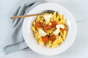 Italian pasta dish with goat cheese and cherry tomatoes