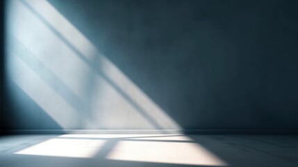 Beautiful gray blue empty wall with lateral lighting and interesting chiaroscuro. Minimalistic background for product presentation