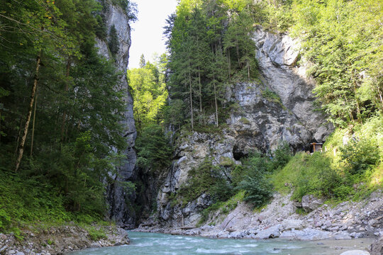 As you gaze upstream, your eyes follow the course of the river that winds its way through the majestic mountain valley located in Partnachklamm Germany