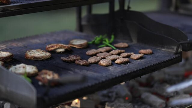 meatballs and meats cooked on the barbecue
