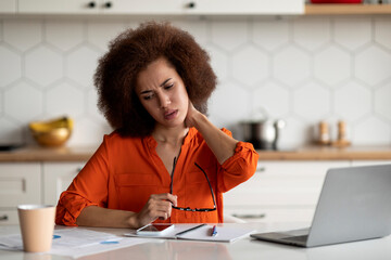 Black Female Suffering Neck Pain After Working With Laptop At Home Office