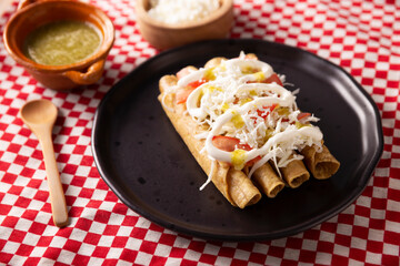Tacos Dorados. Mexican dish also known as Flautas, consists of a rolled corn tortilla with some filling, commonly chicken or beef or vegetarian options such as potatoes.