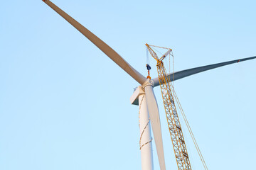 Fototapeta premium Wind turbines being hoisted and under construction