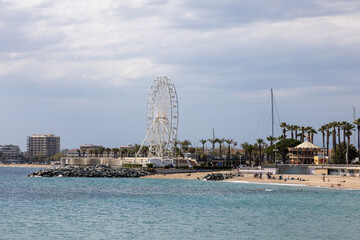 Obraz premium Saint Raphael over the beach and promenade with ferris wheel on the French Riviera, French Riviera