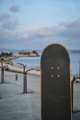 skateboard with sunset boardwalk background © Jimmy