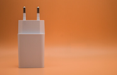 power adapter for phones with orange background 