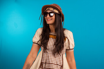Young woman with festa junina outfit in studio