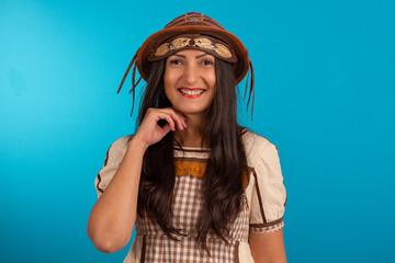 Young woman with festa junina outfit in studio - obrazy, fototapety, plakaty