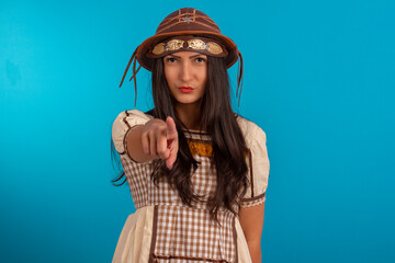 Young woman with festa junina outfit in studio