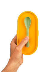 Hands holding lunch box and small spoon. Lunchbox, food container isolated on white