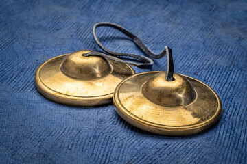 Fototapeta na wymiar tingsha cymbals used in the Tibetan religion in prayers, rituals, meditation, and healing