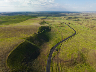 Winding road in green prairie