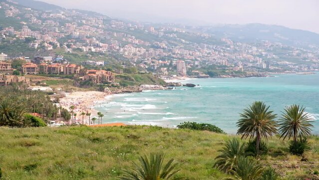 Splashing waves on Byblos beach. View of Jbeil Mediterranean coastline, Lebanon