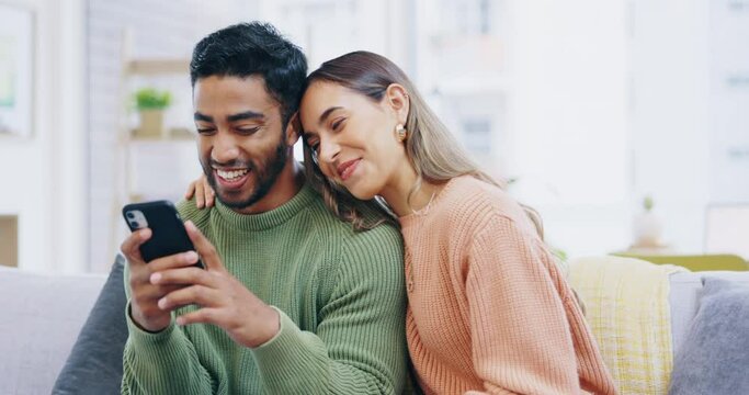 Happy couple, phone and credit card for online shopping, ecommerce or purchase on living room sofa at home. Man and woman shopper smiling on mobile smartphone app for payment or internet banking
