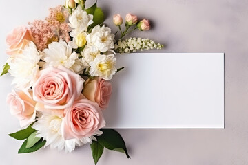 Obraz na płótnie Canvas mockup white paper with flower flower arrangement over a layflat