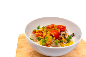 Sop kaki kambing or mutton soup is a traditional food from Betawi-Jakarta, Indonesia. Made from mutton or lamb, spices, coconut milk, and milk. Isolated on white background with copy space.