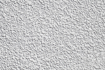 Background the wall is white plastered with drops of white mortar, uniform texture