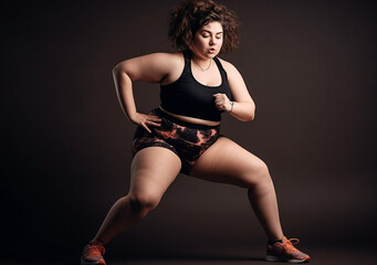 Fototapeta na wymiar Portrait of a fat woman doing sports. Motivation for a healthy lifestyle. Body positivity. Generative AI