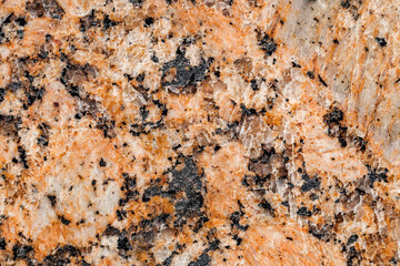 Background marble slab surface orange-black structure, uniform texture, close-up