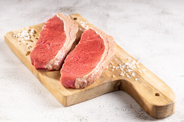 Raw picanha steak on the cutting board.