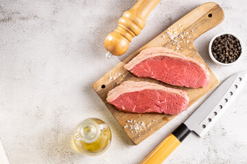 Raw picanha steak on the cutting board.