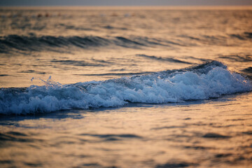 Fototapeta na wymiar Waves during summer sunset at Adriatic sea.