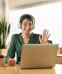 Virtual meeting, business woman and wave on a video call with headphones and greeting. Laptop,...