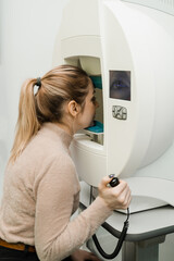 Perimetry eyes test for early sign of glaucoma of woman patient of ophthalmology clinic. Perimetry...